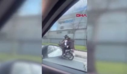 ÜMRANİYE'DE MOTOSİKLET ÜZERİNDE TEHLİKELİ YOLCULUK